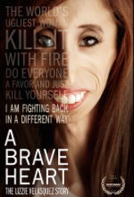 A Brave Heart movie poster. A young woman with a gaunt face, long brown hair, and one cloudy eye smiles at the camera. Text is super imposed over half of her face.